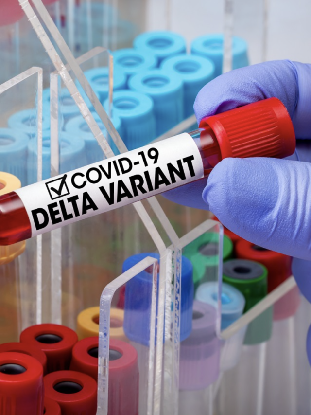 IMAGE: a health worker holding a vile that says "delta variant"